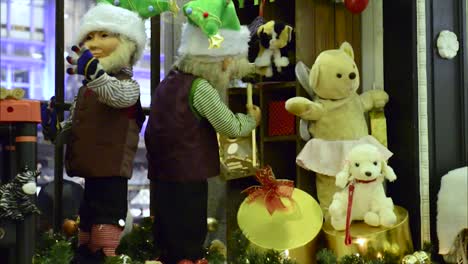 santa's elves moving and working in a shop front in dublin ireland