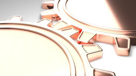 two golden metallic gears rotation. mechanism in motion.