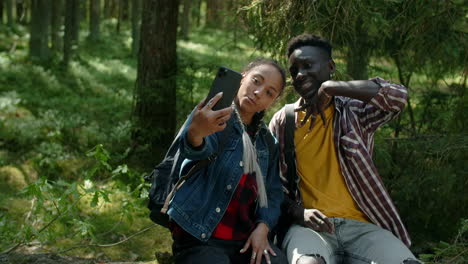 couple taking a selfie in the forest