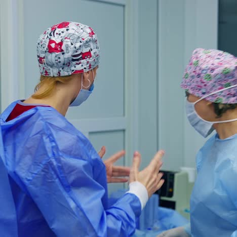 doctors are getting ready for operation. medics wearing special scrubs for ophthalmology vision correction. modern equipment in clinic