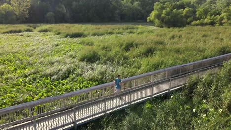 Aerial-view-of-a-man-running-along-Old-Cedar-Avenue-hiking-path-in-Bloomington-Minnesota