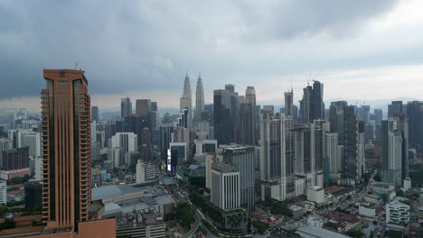 Kuala-Lumpur-Skyline-In-Early-Evening-Cloudy-Tracking-In