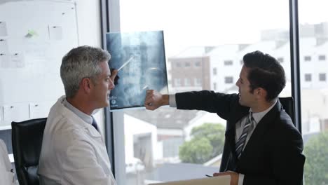 Doctors-and-businessman-looking-at-scans