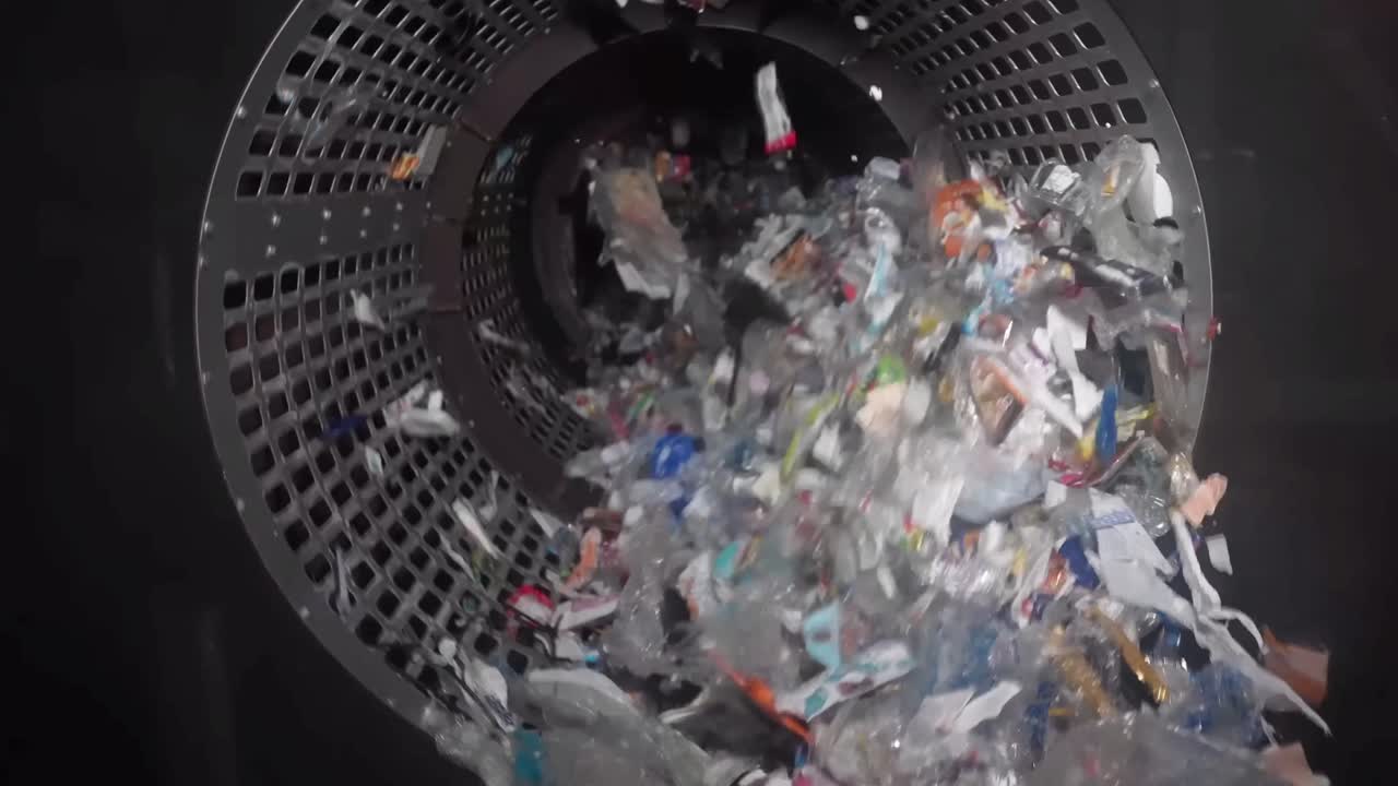 Garbage Recycling Factory, not compostable home equipment, aluminium cans, Plastic cubes for recycle Plant, rubbish warehouse collection. Preparation of recyclables for recycling