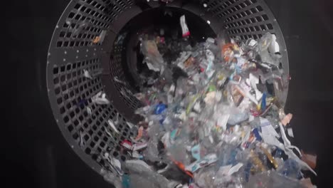 Garbage Recycling Factory, not compostable home equipment, aluminium cans, Plastic cubes for recycle Plant, rubbish warehouse collection. Preparation of recyclables for recycling