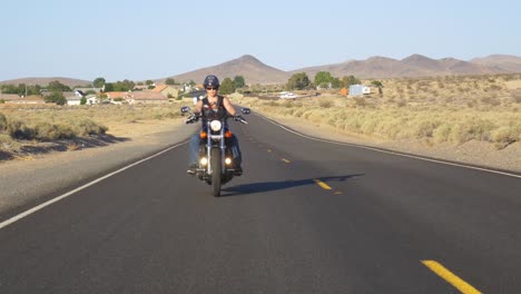 woman motorcyclist with dog