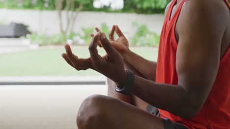 video of african american senior man meditating