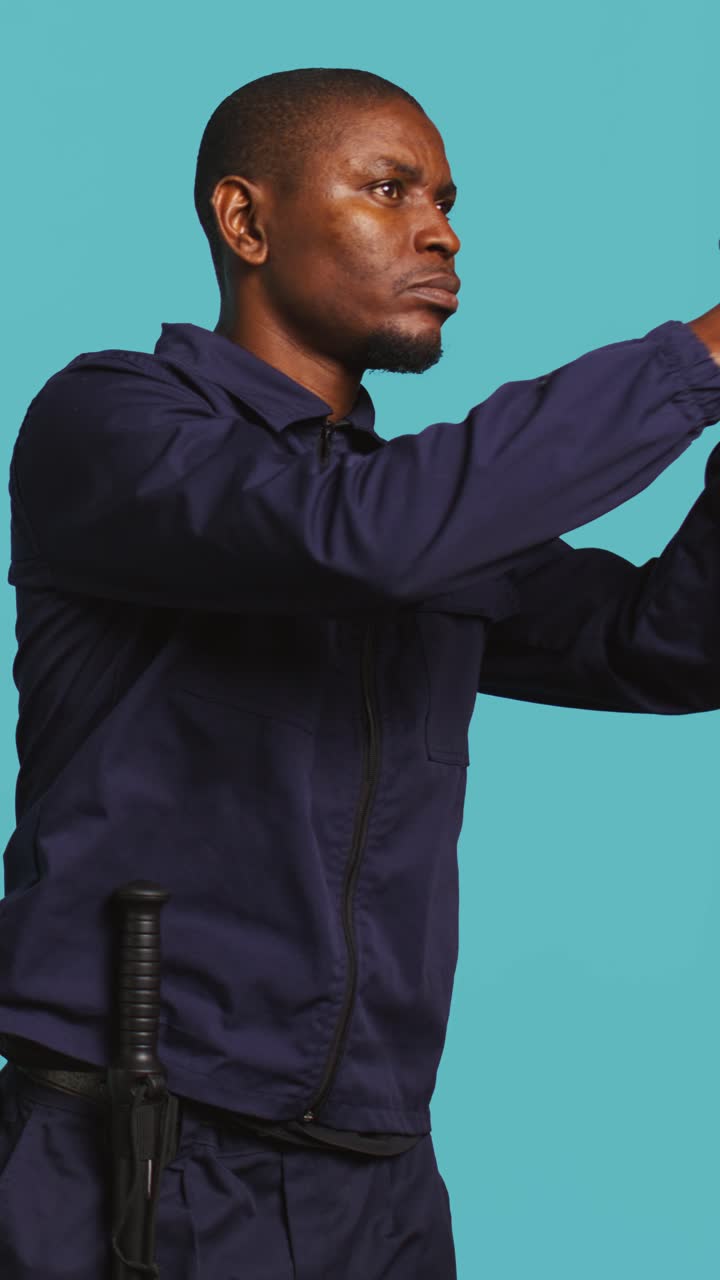 African American Police Officer Making Finger Gun Gesture