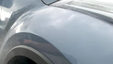 Spraying-ceramic-sealant-onto-car