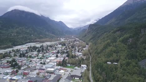 alaskan city in the mountains, skagway alaska, aerial tilt up