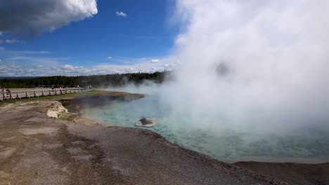 steam rising from hot spring in yellowstone national park, usa