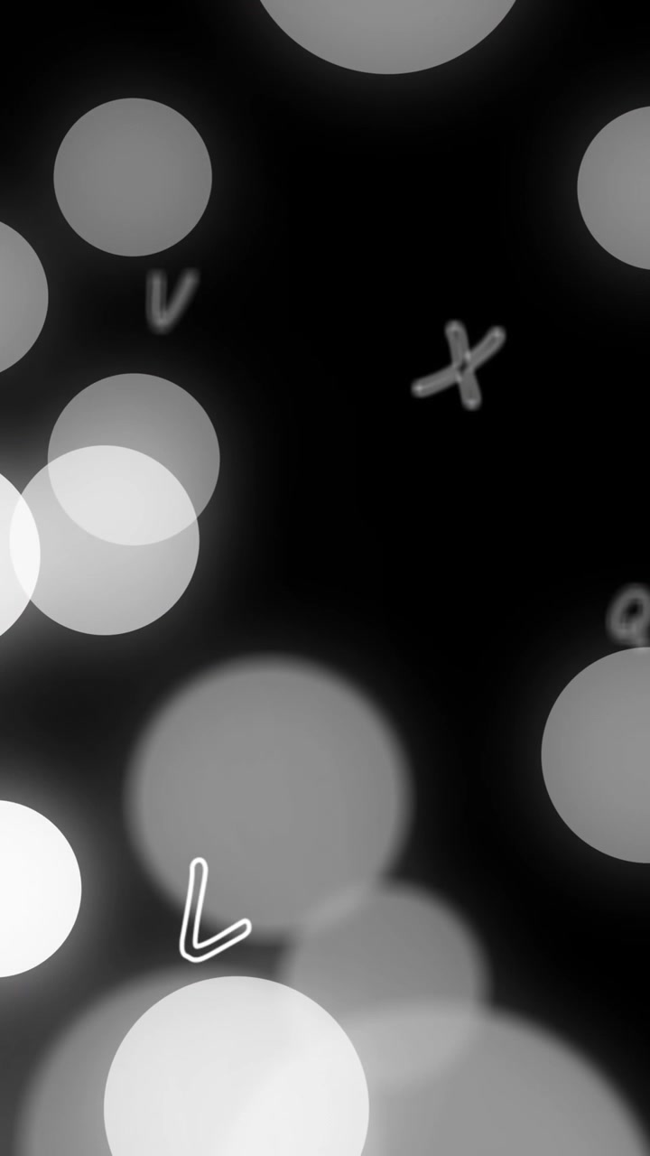 Animation of glowing light spots and letters moving over black background