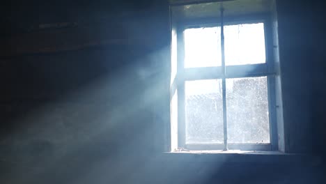 smoke in a ray. light falling from a window.