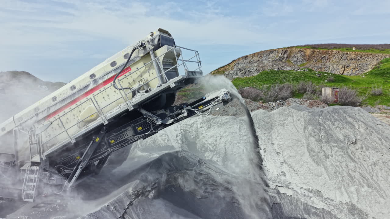 Granite quarry process shows machine extracting stone while dust rises on a sunny day in a rural area