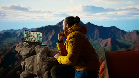 entrepreneur uses high speed internet connection on mountain top