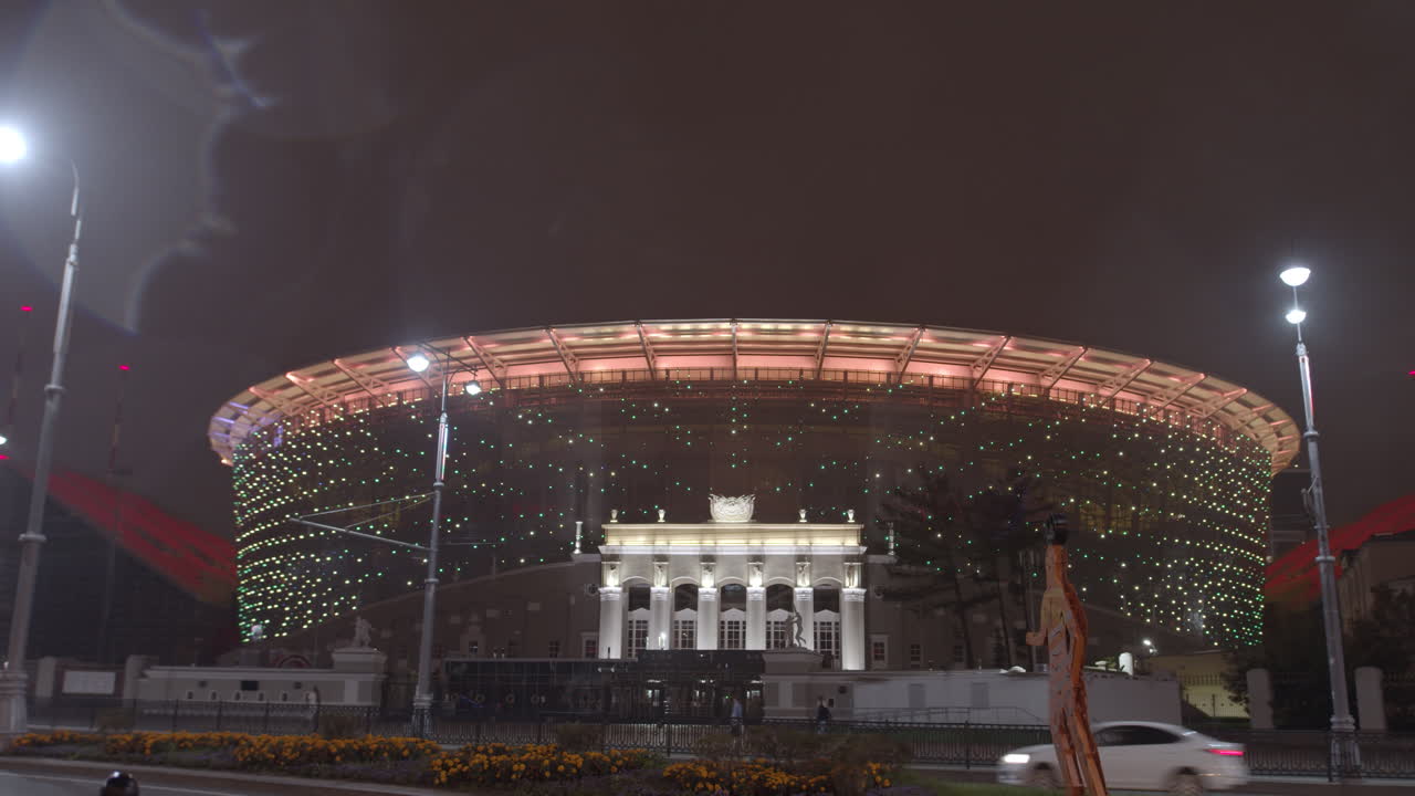 Night view of a large illuminated stadium or event space