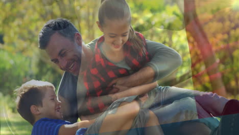 animation of flag of france over caucasian father and children spending time in park