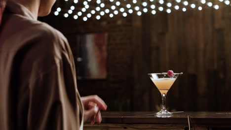 bartender serving a cocktail