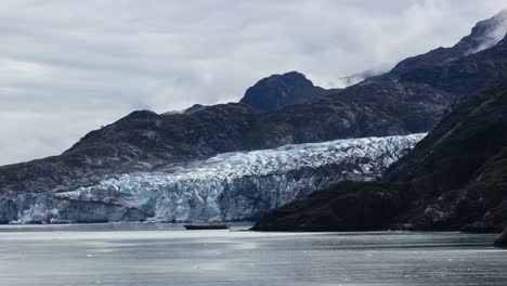 boat close to the glacier in the glacier bay national park, alaska