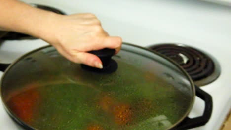 Slow-motion-dolly-into-pan-of-green-beans-and-tomatoes