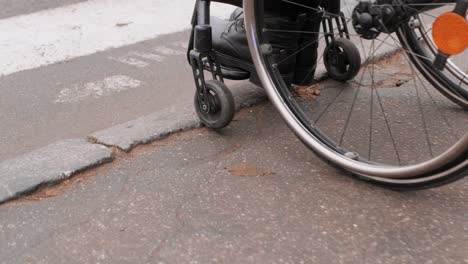 a person with a disability moves along the street in a wheelchair, the border prevents the movement of the wheelchair