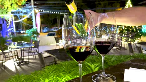 wine glasses filled at a decorated outdoor setting