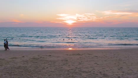 sunset beach scene with people