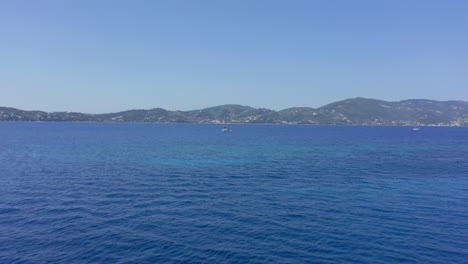 Aerial:-Motorised-Sailboat-in-the-open-blue-sea