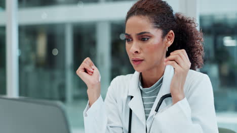 a stressed female doctor with a headache