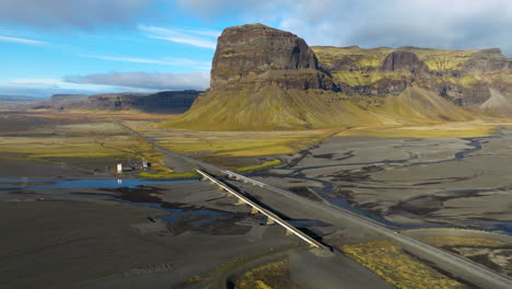 hringvegur road with lomagnupur mountain in iceland during summer