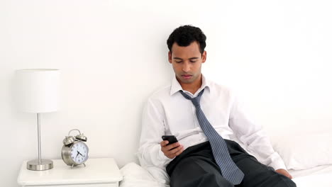 Happy-handsome-businessman-texting