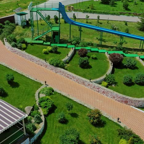 swimming pool in recreation center. modern territory for leisure activity in the countryside. stylish recreation area on outdoor weekends in summer. aerial view.
