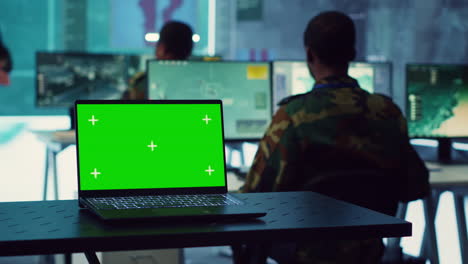 Greenscreen-running-on-a-laptop-in-military-base-command-center