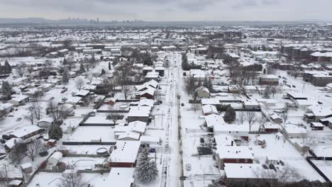 airshot over the city of st-constant, québec completely covered in snow in december