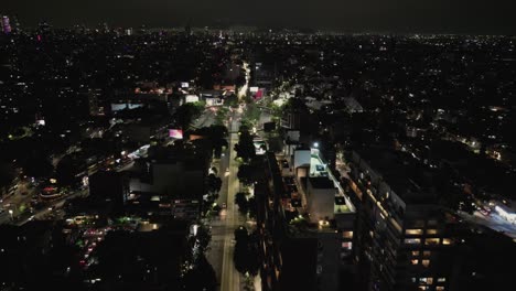 Nighttime-drone-flight-over-the-Del-Valle-neighborhood,-an-important-and-well-established-area-in-Mexico-City