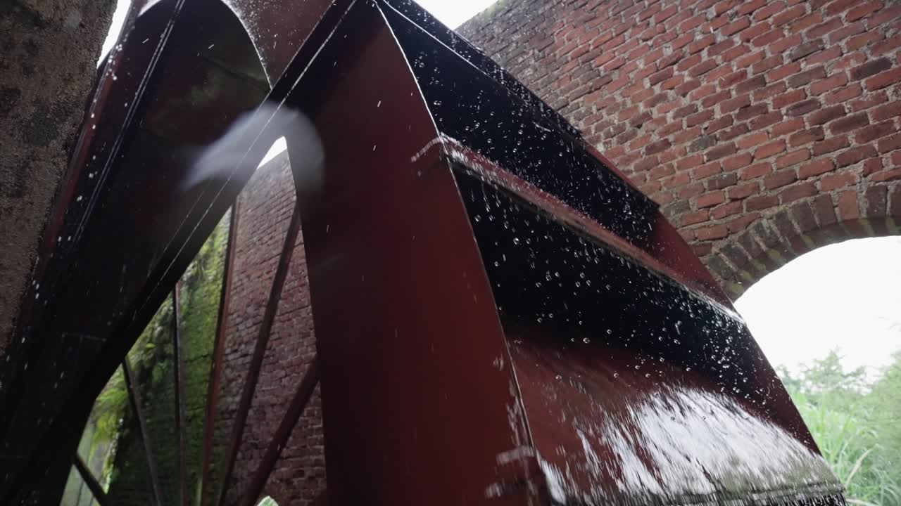 SLOW MOTION OF A WATER MILL FROM A SUGAR CANE PLANTATION IN MICHOACAN