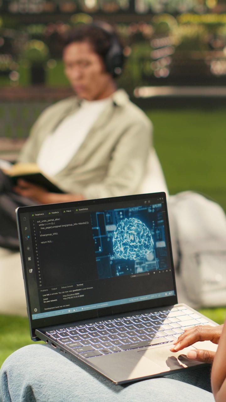 Vertical Video Woman student using binary code and artificial intelligence on laptop
