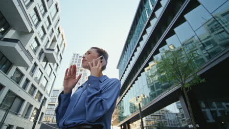 annoyed business woman calling at modern downtown close up. nervous woman talk