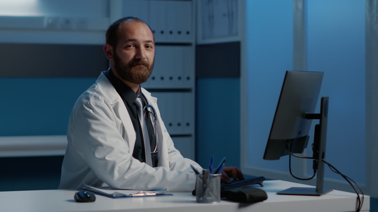 Medical professional working at computer in office