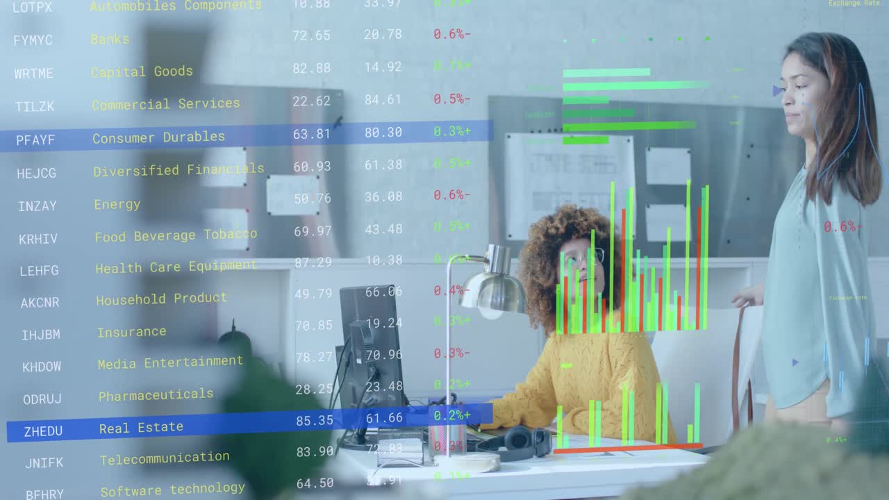 Data processing on interface over diverse female colleagues discussing at desk in casual office