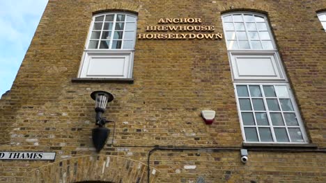 old brick building entrance in shad thames, london