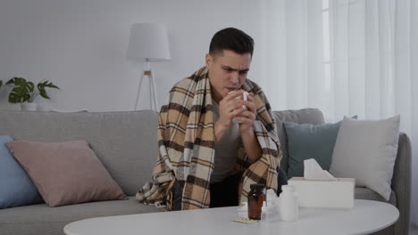 man feeling ill at home