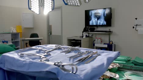 close up of surgical instruments on table in operating theatre at hospital, slow motion