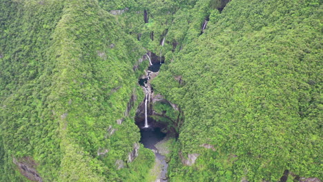 aerial view over the takamaka waterfalls on the marsouins river, reunion island