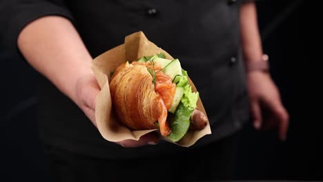 croissant sandwich with salmon and cucumber