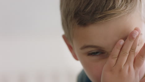 portrait happy little boy wiping nose looking at camera child with flu 4k footage