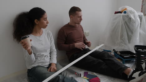 Young Couple Planning Home Renovation Project