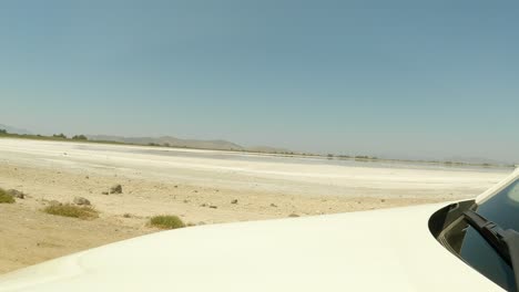 Close-Up-Of-Hood-Of-The-Car-While-Passing-By-The-Igroviotopos-Alikis-Salt-Pan-In-Kos,-Greece