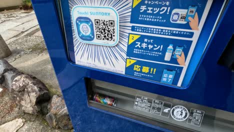 person buying a drink from a vending machine