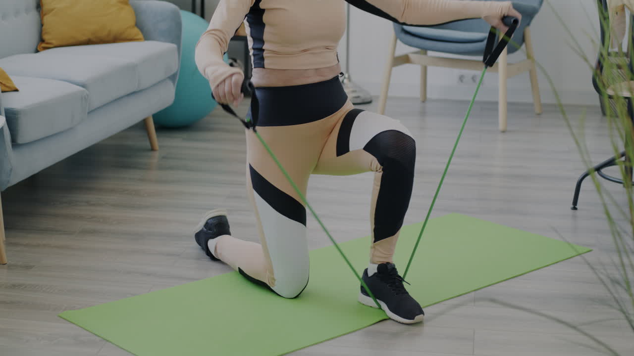 Women doing resistance band exercises at home